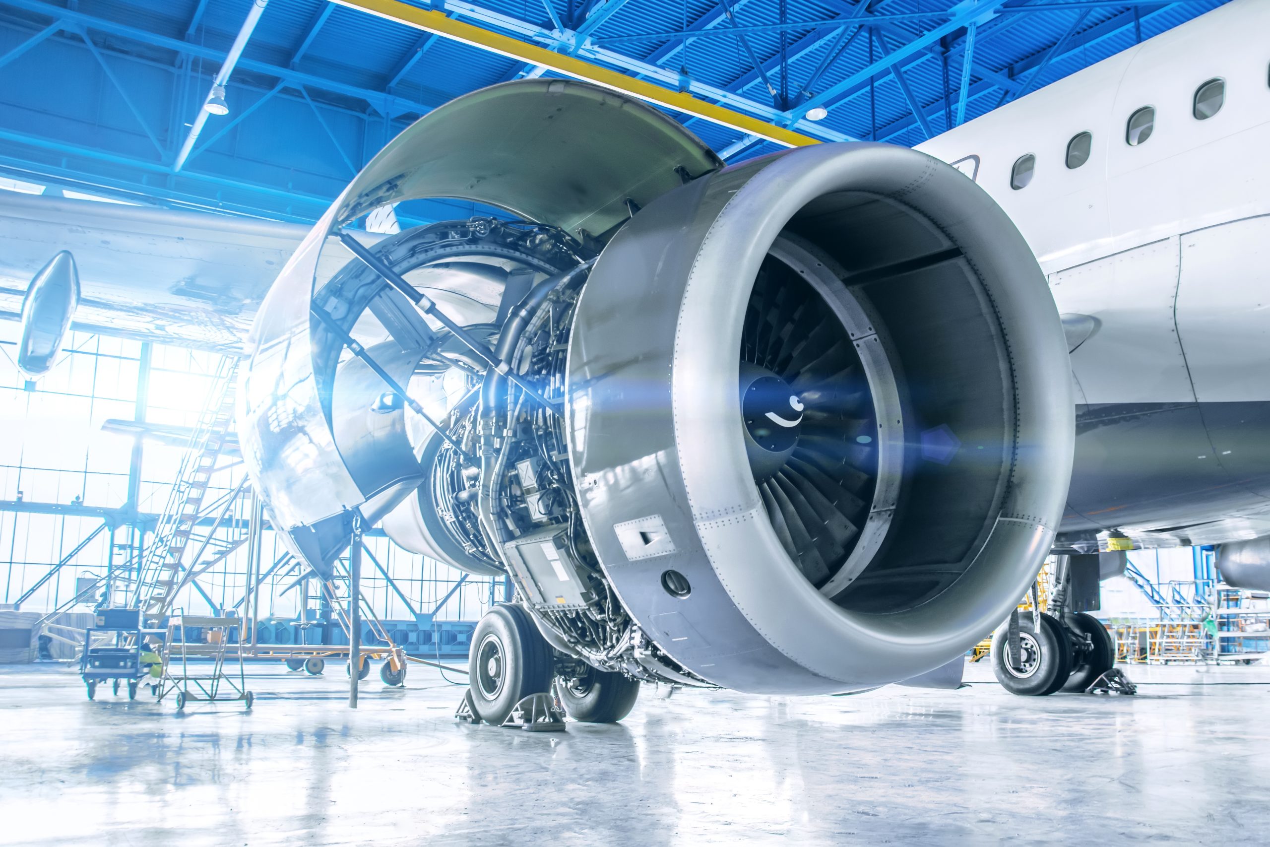 Jet engine sits in an airport hangar for maintenance to highlight Vortex SAP aerospace experience.
